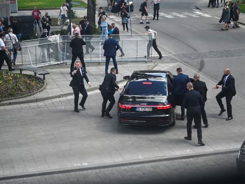  Security officers move Slovak PM Robert Fico in a car after a shooting incident, after a Slovak government meeting in Handlova, Slovakia, May 15, 2024.