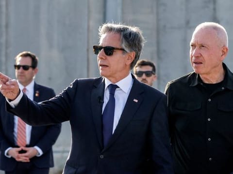  US Secretary of State Antony Blinken gestures as he walks with Israeli Defence Minister Yoav Gallant at the Kerem Shalom border crossing with the Gaza Strip in southern Israel on May 1, 2024.  