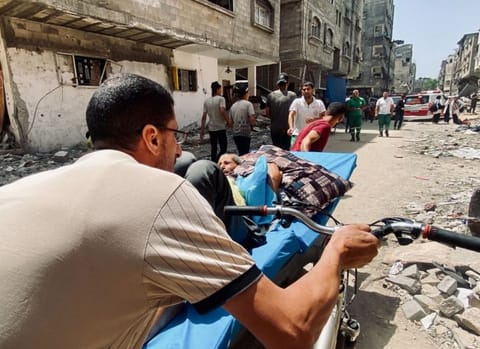 Palestinians evacuate Kamal Adwan hospital following an Israeli strike, amid the ongoing conflict between Israel and the Palestinian Islamist group Hamas, in Beit Lahia in the northern Gaza Strip, May 21, 2024.  