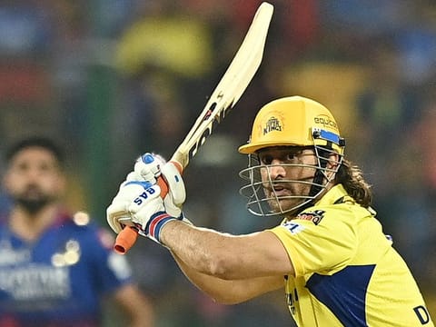 MS Dhoni plays a shot during the Indian Premier League cricket match in Bengaluru on May 18, 2024. Dhoni played all 14 league games for Chennai Super Kings, scoring 161 runs at a strike rate of 220.55. 