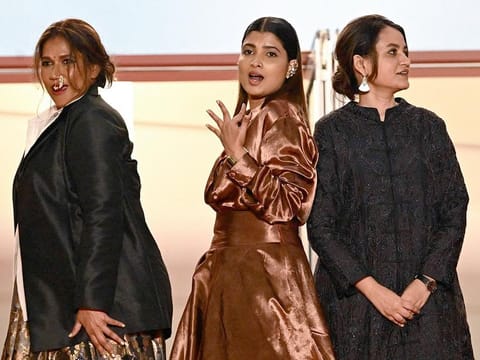 From left: Indian actress Chhaya Kadam, Indian actress Divya Prabha and Indian director Payal Kapadia arrive for the screening of the film "All We Imagine as Light" at the 77th edition of the Cannes Film Festival in Cannes, southern France, on May 23, 2024. 