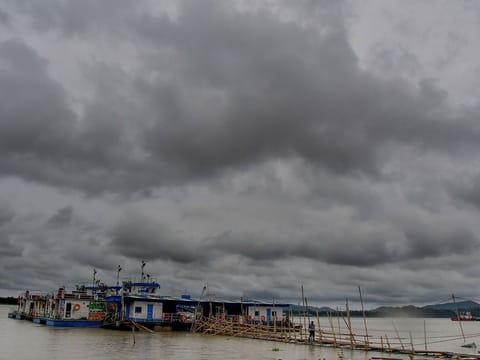 Dark clouds hover over the sky of Guwahati on Monday, following the landfall of Cyclone Remal in India's Assam state.