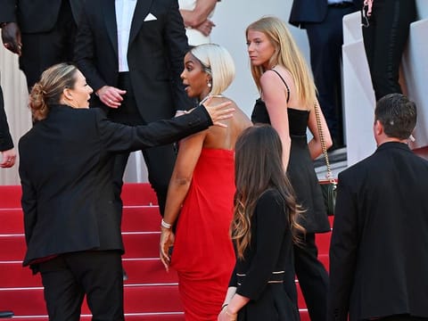 Kelly Rowland isn't happy with this overbearing security guard manning the red carpet at the Cannes Film Festival 