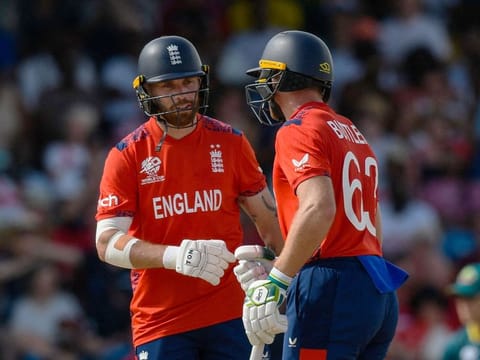 England’s Phil Salt (left) and captain Jos Buttler during the ICC Men’s Twenty20 World Cup Group B cricket match against Australia at Kensington Oval in Bridgetown, Barbados, on June 8, 2024. Australia won by 36 runs.