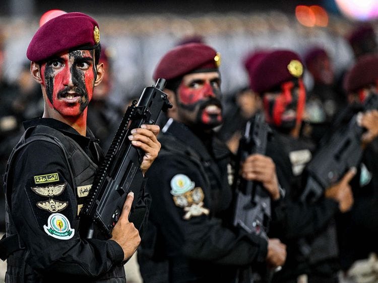 Saudi security forces take part in a military parade as pilgrims arrive for the annual Hajj pilgrimage in Mecca on June 10, 2024.  