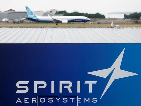 A Boeing 737 MAX-10 lands over the Spirit AeroSystems logo during a flying display at the 54th International Paris Air Show at Le Bourget Airport near Paris, France.