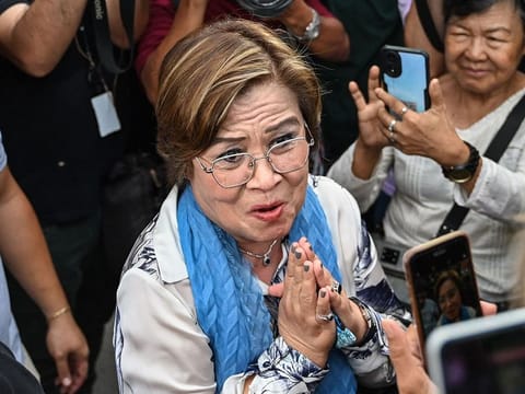 Former Philippine senator and human rights campaigner Leila de Lima, jailed for 7 years by Duterte on trumped-up charges, acknowledges supporters after all remaining criminal charges against her were dropped, outside a court in Muntinlupa. As of Tuesday (May 13), latest poll figures show her party-list, Mamamayang Liberal (ML), has gained a seat in the House of Representatives. File photo.