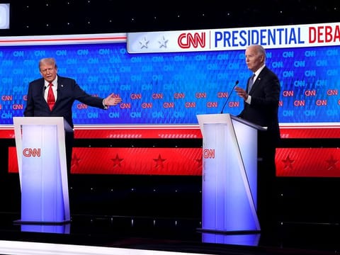 US President Joe Biden (R) and Republican presidential candidate, former US President Donald Trump participate in the CNN Presidential Debate at the CNN Studios on June 27, 2024 in Atlanta, Georgia. 