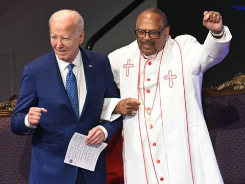 US President Joe Biden with Bishop Ernest Morris, Sr. during a church service and campaign event at Mount Airy Church of God in Christ in Philadelphia, Pennsylvania, on July 7, 2024. Biden is back out on the campaign trail Sunday, desperate to salvage his re-election bid as senior Democrats meet to discuss growing calls that he quit the White House race.  
