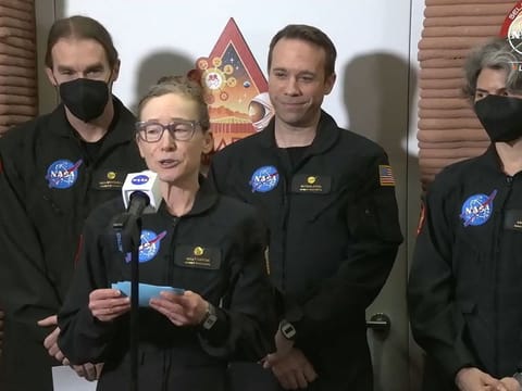 In this still image taken from a July 6, 2024, Nasa TV broadcast, volunteer crew commander Kelly Haston speaks alongside crewmates (from left) Ross Brockwell, Nathan Jones and Anca Selariu, as they exit the first simulated yearlong Mars habitat mission at Johnson Space Center in Houston, Texas.  