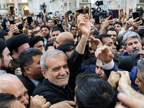 Iran's newly-elected President Masoud Pezeshkian with his supporters as he visits the shrine of the Islamic Republic's founder Ayatollah Ruhollah Khomeini in Tehran on July 6, 2024.  