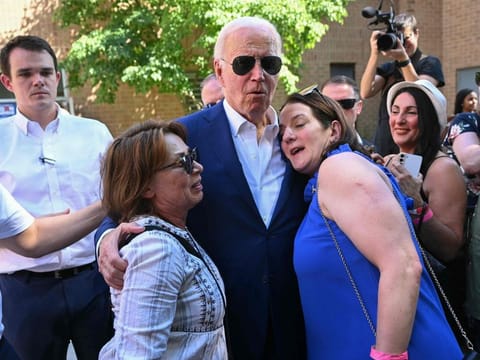 US President Joe Biden greets supporters and volunteers during a campaign stop at a Biden-Harris campaign office in Harrisburg, Pennsylvania, on July 7, 2024.  
