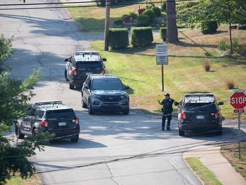 Local police block off roads surrounding the home of the suspected shooter of Trump, as the FBI carries out an investigation, in Bethel Park, Pennsylvania, on July 14, 2024.  The alleged shooter was killed by law enforcement officials after he fired an AR-15-type semiautomatic rifle, killing one spectator and wounding others.
