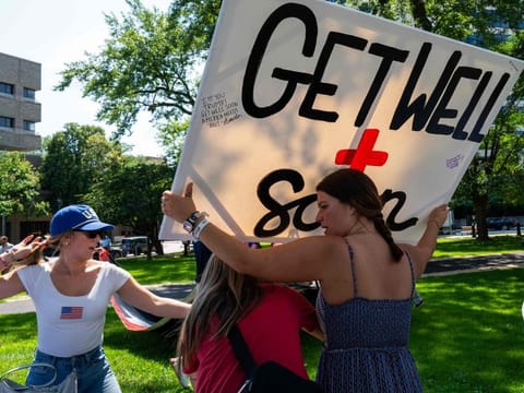 People attend a prayer vigil and voter registration event for former president Donald Trump in the downtown area before the start of the Republican National Convention (RNC) on July 14, 2024 in Milwaukee, Wisconsin.  
