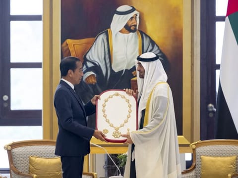 His Highness Sheikh Mohamed bin Zayed Al Nahyan, President of the United Arab Emirates (R) presents a Zayed Medal to Joko Widodo, President of Indonesia (L), during a state visit reception, at Qasr Al Watan.