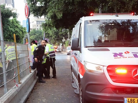 Team members from the ZAKA Search & Rescue at the scene of the explosion in Tel Aviv.