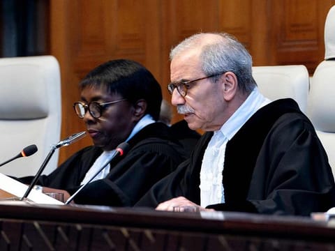 Judge and President of the International Court of Justice (ICJ), Nawaf Salam (right) delivers a non-binding ruling on the legal consequences of the Israeli occupation of the West Bank and East Jerusalem at the International Court of Justice (ICJ) in The Hague on July 19, 2024. 