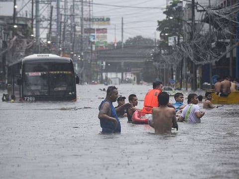Photos: Typhoon Gaemi turns Philippine streets into rivers