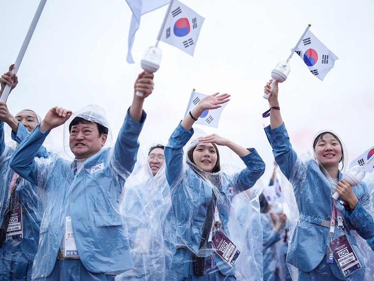 South Korea's delegation sail in a boat