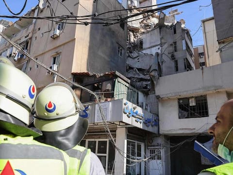 Lebanese security forces check the area in the aftermath of an Israeli military strike on a building in Beirut's southern suburb on July 31, 2024. 