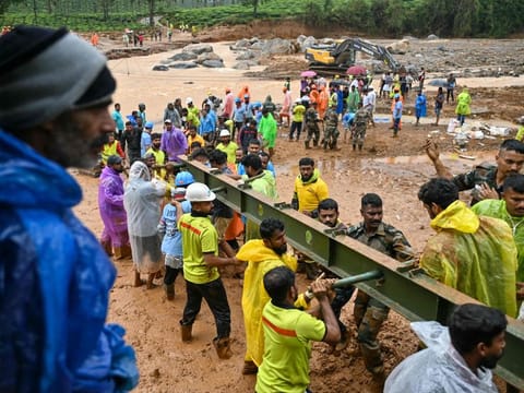 Relief personnel conduct a search and rescue operation after landslides in Wayanad on July 31, 2024.  