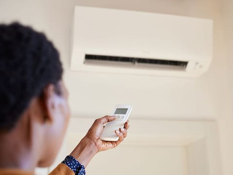 Turning off your AC might seem like a quick way to cut costs, but it could end up costing you more in the long run. You risk expensive repairs and even health hazards. Picture used for illustrative purposes. 