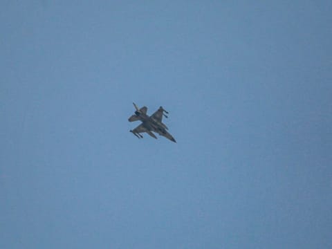 An Israeli army fighter jet releases fares above Khan Younis, in the southern Gaza Strip on July 24, 2024.