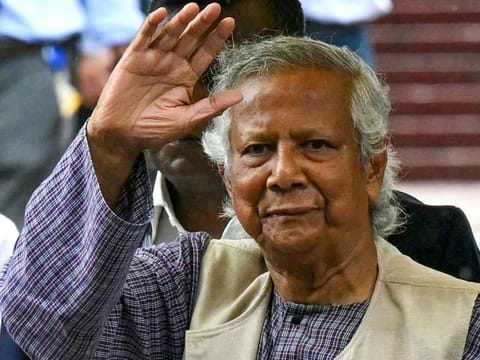 Nobel laureate and chief adviser of Bangladesh's new interim government, Muhammad Yunus greets the public after laying a wreath at the National Martyrs' Memorial in Dhaka.