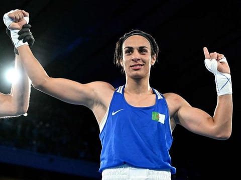 Algeria's Imane Khelif (Blue) reacts after beating Thailand's Janjaem Suwannapheng in the women's 66kg semi-final boxing match during the Paris 2024 Olympic Games at the Roland-Garros Stadium, in Paris on August 6, 2024. 