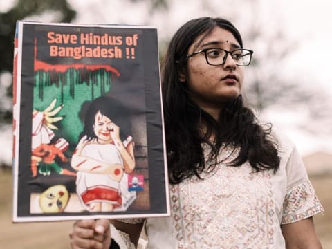 A South African Hindu community member protests against violence targeting Bangladeshi Hindus and other minorities during a demonstration in Phoenix township, north of Durban on August 11, 2024.  