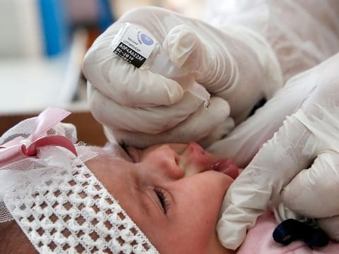 File photo: A UNRWA employee provides Polio vaccine and Rota virus vaccines for children in a clinic in Bureij refugee camp central of Gaza Strip on September 9, 2020. 