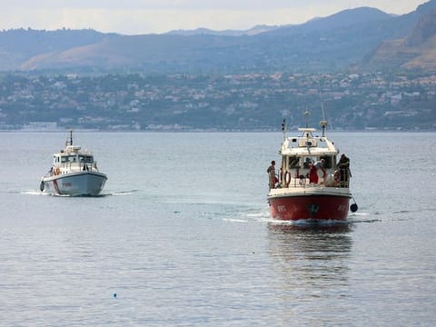 A Coast Guard boat and an Italian fireboat search for six others missing after recovering a victim due to a sailboat sank off the coast of Porticello, nosthwestern of Sicily Island, on August 19, 2024. 