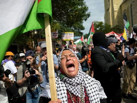 Pro-Palestinian demonstrators during the Democratic National Convention (DNC) near the United Center in Chicago, Illinois, US, on Monday, Aug. 19, 2024. Months of Democratic infighting over Israel and US aid for its offensive in Gaza precede the Democratic 