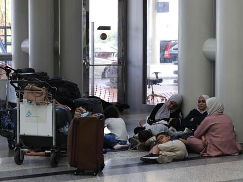 Passengers wait for their flights at the Beirut International Airport in Beirut on August 25, 2024, amid escalations in the ongoing cross-border tensions between Hezbollah and Israel. 
