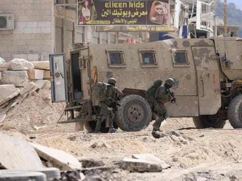 Israeli soldiers operate during a raid in the Nur Shams camp for Palestinian refugees near the city of Tulkarem in the Israeli-occupied West Bank on August 28, 2024.  