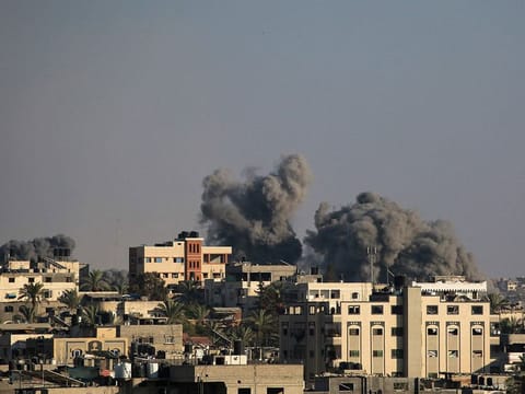 Smoke billows during Israeli airstrikes on areas southeast of Deir el-Balah city.