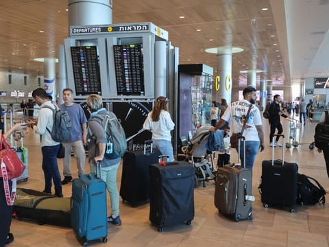 Passengers wait for flights at the Ben Gurion Airport in Tel Aviv during a nationwide strike on September 2, 2024.  