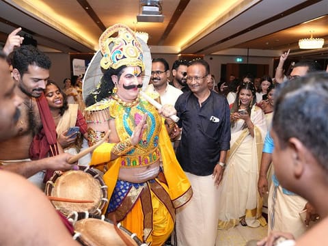 Dressed as Kerala’s mythical King Mahabali or Maveli, Egyptian expat Monzer Nawar greets his colleagues and senior executives, including Dr Sathya Menon to his left, during the company’s early Onam celebrations in Dubai. 