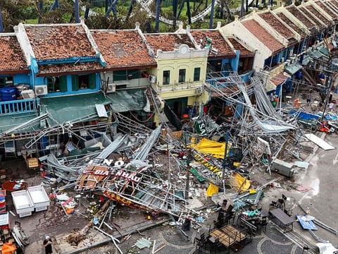 Damaged buildings and debris on a street after Super Typhoon Yagi hit Ha Long, in Quang Ninh province.