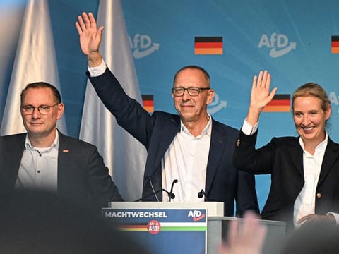 (L-R) Co-leader of the far-right Alternative for Germany (AfD) party Tino Chrupalla, top candidate of the far-right Alternative for Germany party (AfD) for the upcoming Saxony state elections Joerg Urban and co-leader of the far-right Alternative for Germany (AfD) party Alice Weidel wave on stage during a campaign event in the historic center of Dresden, eastern Germany on August 29, 2024. 