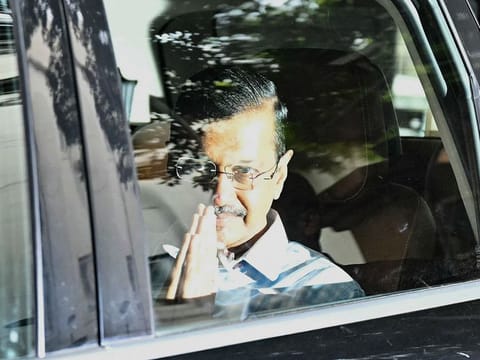 Aam Aadmi Party (AAP) leader and former chief minister of Delhi Arvind Kejriwal, gestures as he leaves the Lieutenant Governor of Delhi's office in New Delhi 