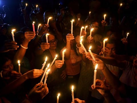 People hold a candlelight vigil to protest against the RG Kar Medical College & Hospital rape-murder in Kolkata 