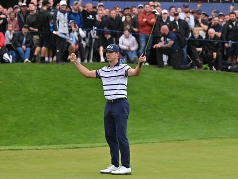 US golfer Billy Horschel celebrates on the 18th green after holing an eagle putt at the second playoff hole to win the BMW PGA Championship at Wentworth Golf Club, south-west of London, on Sunday.