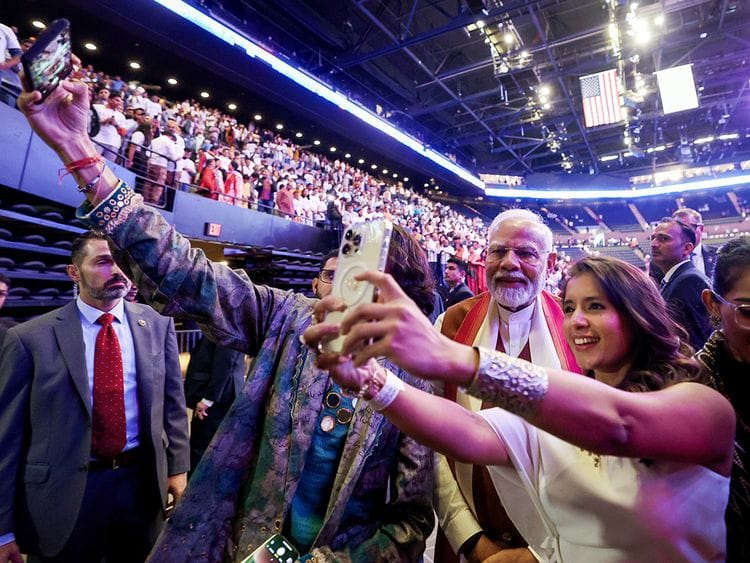 Prime Minister Narendra Modi greets members of the Indian diaspora after addressing the gathering, at Nassau Coliseum in New York. 