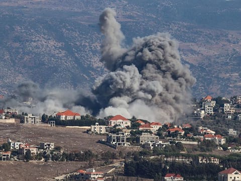 Smoke rises from the site of an Israeli airstrike that targeted the southern Lebanese village of Khiam on September 25, 2024. 