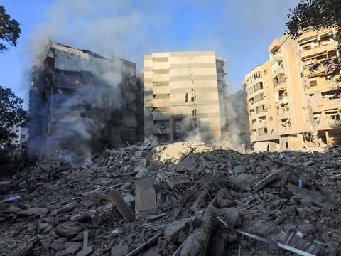 Smoke rises from the debris of a destroyed building in the aftermath of an Israeli strike on the neighbourhood of Mreijeh in Beirut's southern suburbs on October 4, 2024. 
