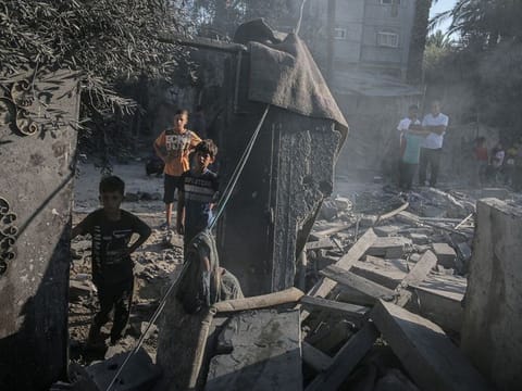 Palestinian children amongst the debris following an Israeli airstrike in Deir Al Balah, central Gaza, on Friday, October 4, 2024.  