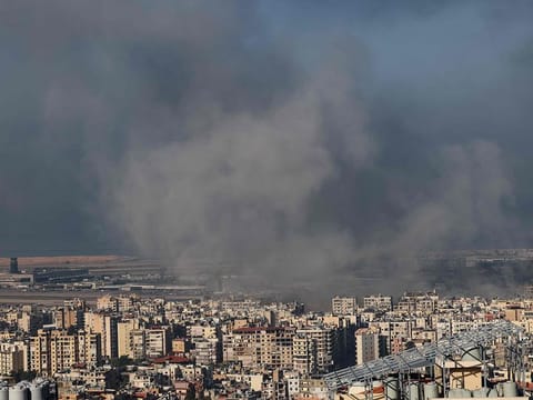 Smoke rises from the site of an Israeli airstrike that targeted Beirut’s southern suburbs, on October 5, 2024. Beirut International Airport can be seen on the left.   