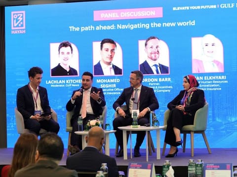 From left: Lachlan Kitchen, Moderator; Mohamed Seghir, CEO of HAYAH Insurance; Gordon Barr, Partner, Employment & Incentives at Al Tamimi & Company; and Iman Elkhyari, Head of Human Resources & Emiratisation at HAYAH Insurance during the panel discussions on The Path Ahead - Navigating the New World