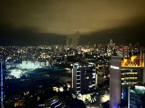 Smoke plumes rise from the site of two Israeli airstrikes on a neighbourhood in Beirut.
